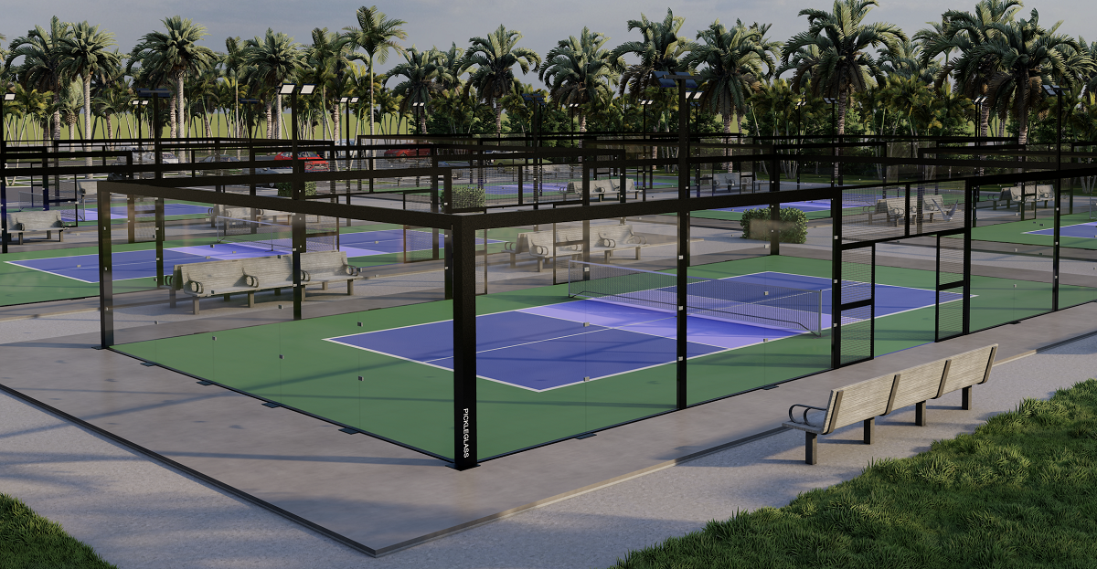 Pickleball courts in tropical setting with POCKLEGLASS surround each court.